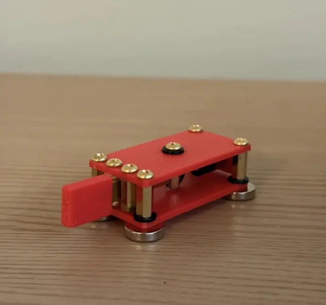 W4ARB compact 3D printed portable CW straight key in red with brass posts and magnetic base